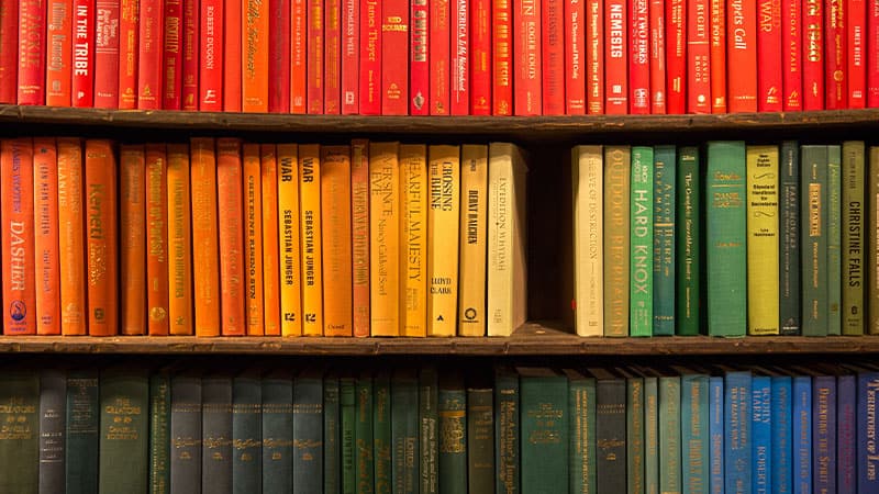 rainbow books on bookshelf