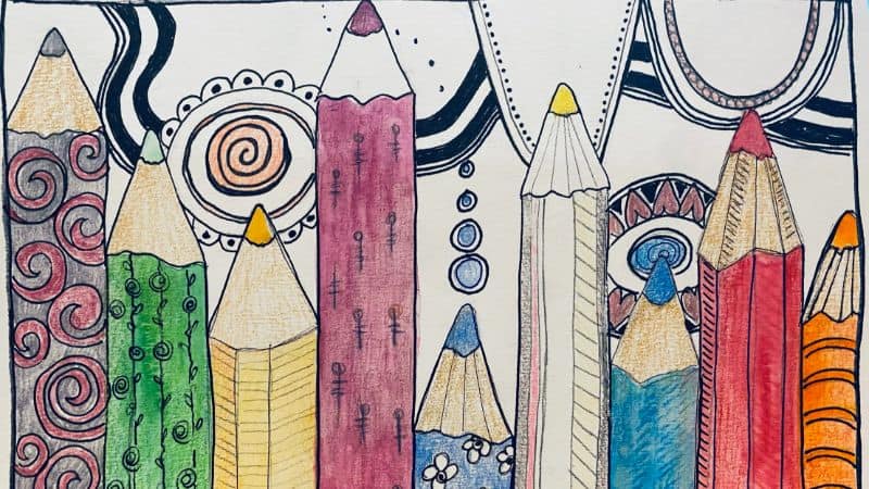 colorful pencils lined up with mindful zen dooles across the top of the page.